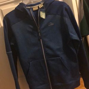 Blue sweatshirt. Zipper hood and pockets.